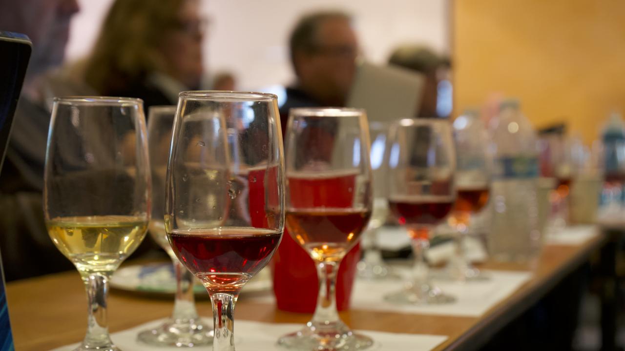 Mead in glasses in front of people tasting